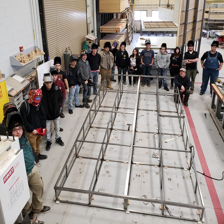 Santa Fe Early College Opportunities (ECO) high school students and deck they helped to construct in The Santa Fe Opera Scene Shop